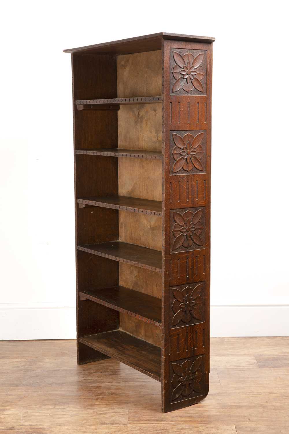 Lot 94 - Arts and Crafts oak and stained pine, narrow...