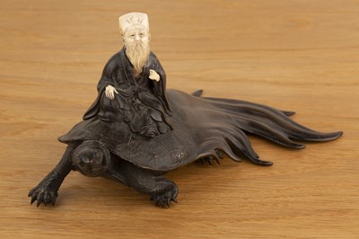 Lot 405 - Bronze and ivory model of a Sennin on a long...