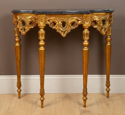 Lot 56 - A Rococo style marble-topped gilt-painted console table