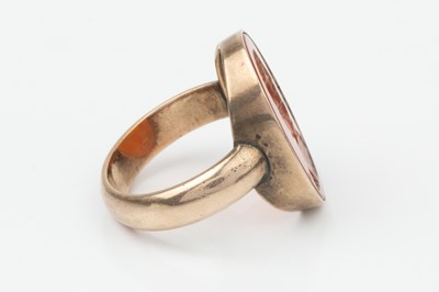 Lot 319 - A 19th century carnelian seal ring, the oval...