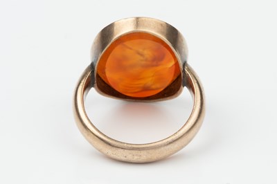 Lot 319 - A 19th century carnelian seal ring, the oval...