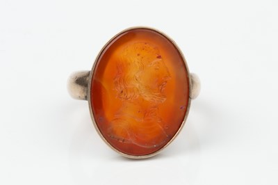 Lot 319 - A 19th century carnelian seal ring, the oval...