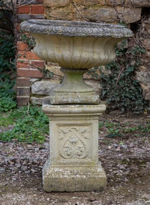 Lot 1165 - A cast reconstituted stone garden urn