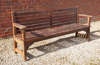 Lot 1303 - A teak garden bench