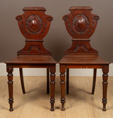 Lot 398 - A pair of mahogany hall chairs