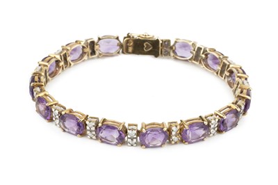 Lot 320 - An amethyst and diamond bracelet, set with...