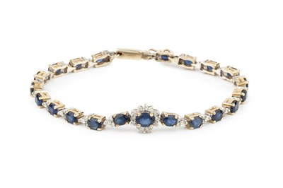 Lot 321 - A sapphire and diamond bracelet, the oval cut...