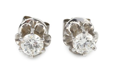 Lot 322 - A pair of diamond single stone ear studs, the...