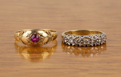 Lot 519 - Two 18ct gold rings the first set with seven...