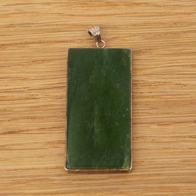 Lot 242 - Spinach jade rectangular pendant Chinese, 20th...