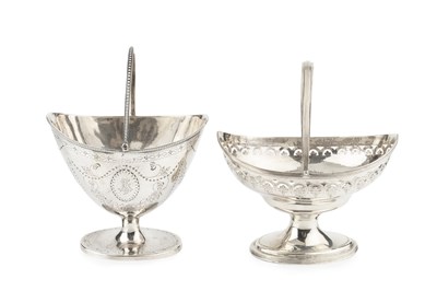 Lot 699 - A George III silver swing handled sugar basket,...