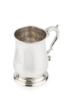 Lot 701 - A George III silver pint mug, of baluster form,...