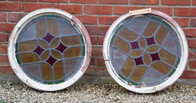 Lot 1156 - A pair of early 20th century circular leaded coloured glass windows