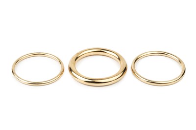 Lot 340 - A 9ct gold hollow circular bangle, of plain...