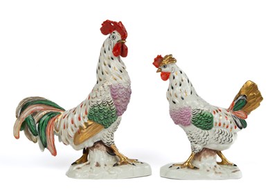 Lot 27 - A pair of Continental pottery figures of a cockerel and a chicken