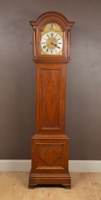 Lot 402 - A continental oak longcase clock