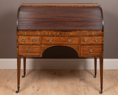 Lot 310 - A Georgian mahogany roll-top desk