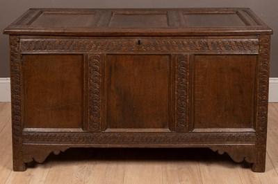 Lot 1030 - A three-panelled oak coffer