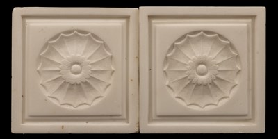 Lot 1220 - A pair of marble roundels