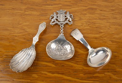 Lot 488 - Three silver caddy spoons comprising a...