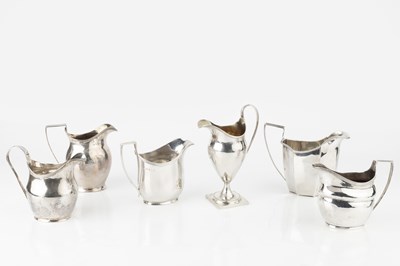 Lot 723 - A George III silver cream jug, on square...