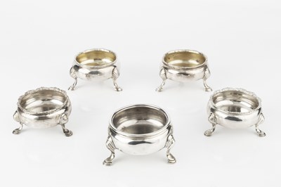 Lot 683 - A pair of George II silver circular salts, on...