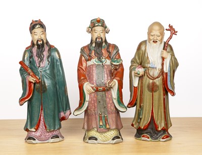 Lot 380 - Three large porcelain figures of Immortals...