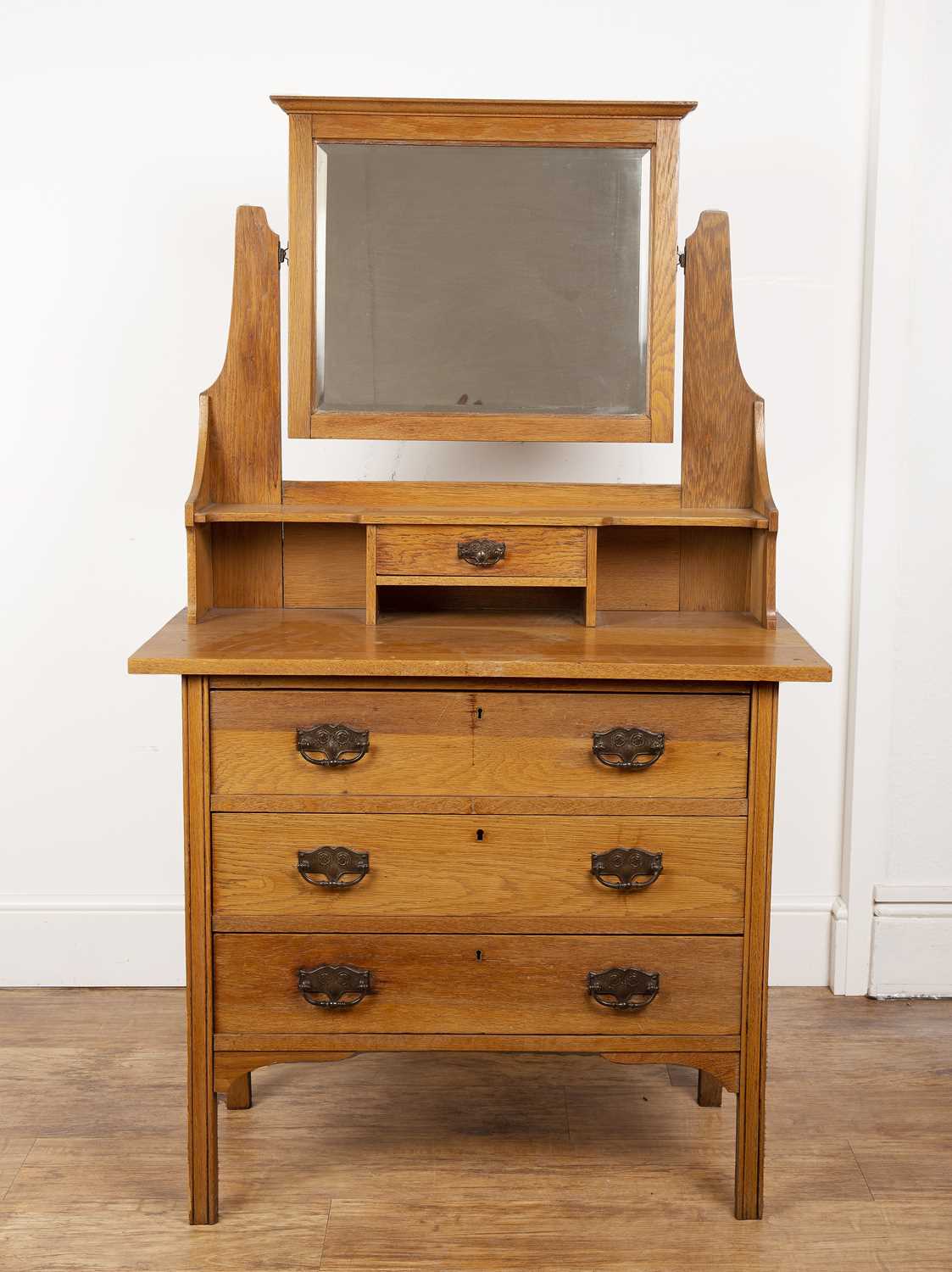 Lot 24 - In the manner of Liberty & Co oak, dressing...