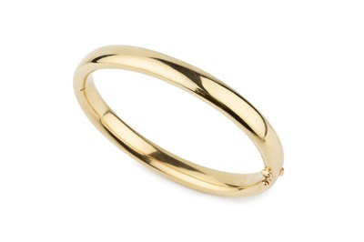 Lot A French yellow gold oval hinged bangle, of...