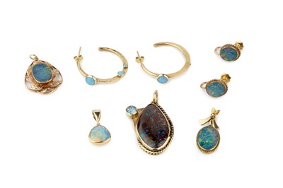 Lot 32 - Three doublet opal pendants, one mounted in...