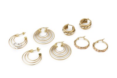 Lot 33 - A pair of 14k two-colour gold hoop earrings,...