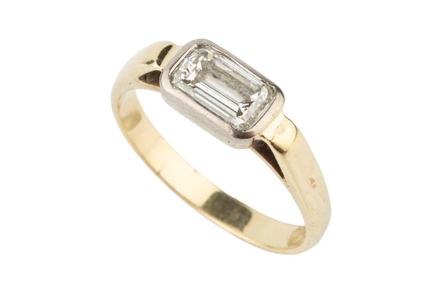 Lot A diamond solitaire ring, the emerald cut...