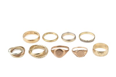 Lot 37 - Two 18ct gold wedding bands, one with textured...