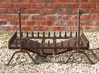 Lot 1322 - A wrought iron fire grate