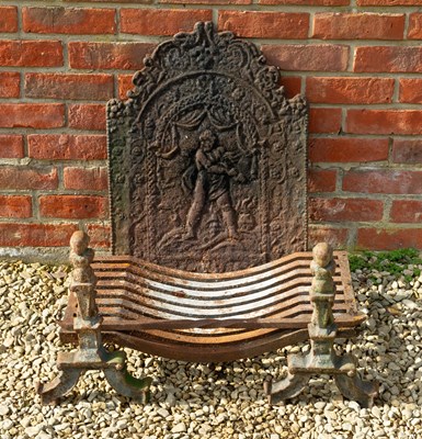 Lot 1209 - A cast iron fire grate and dogs, together with a fire back