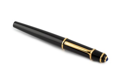 Lot 620 - A Cartier ball point pen, in black with blue...