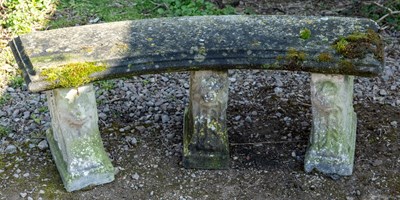 Lot 1166 - A cast reconstituted stone curving garden bench