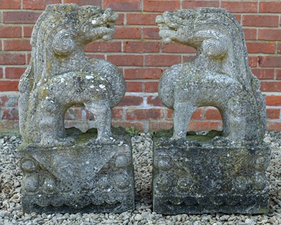 Lot 1305 - A pair of Oriental carved stone dragons