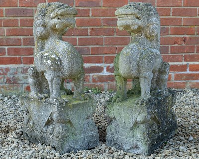 Lot 1305 - A pair of Oriental carved stone dragons