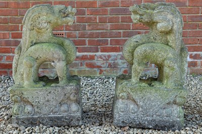 Lot 1305 - A pair of Oriental carved stone dragons