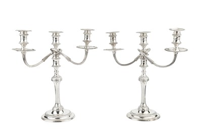 Lot 947 - A pair of silver three light candelabra, the...