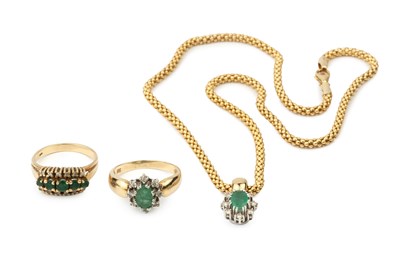 Lot 53 - A 14k gold, emerald and diamond cluster...