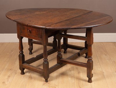 Lot 1128 - A 17th or 18th century oak gateleg table