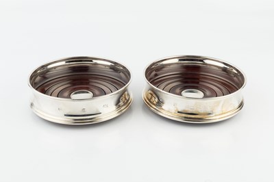 Lot 278 - A pair of modern silver bottle coasters, with...