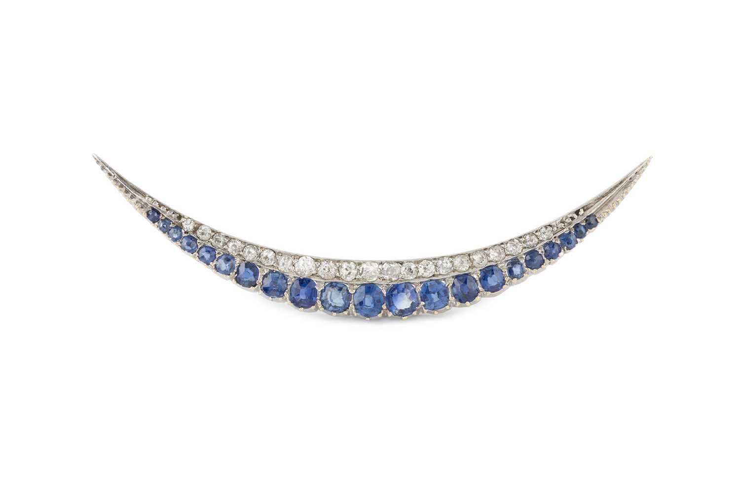 Lot A sapphire and diamond crescent brooch, set...