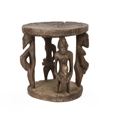 Lot 112 - An antique Senufo stool, with four carved...