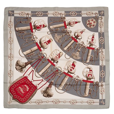 Lot 574 - A 'Cliquetis' silk scarf by Hermès, designed...