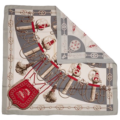 Lot 574 - A 'Cliquetis' silk scarf by Hermès, designed...