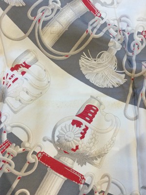 Lot 574 - A 'Cliquetis' silk scarf by Hermès, designed...