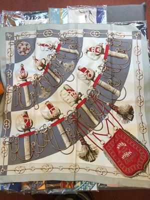 Lot 574 - A 'Cliquetis' silk scarf by Hermès, designed...